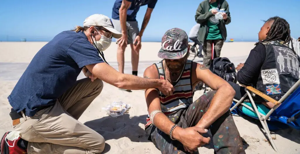Dr. Coley King providing medical care during street outreach in Venice.