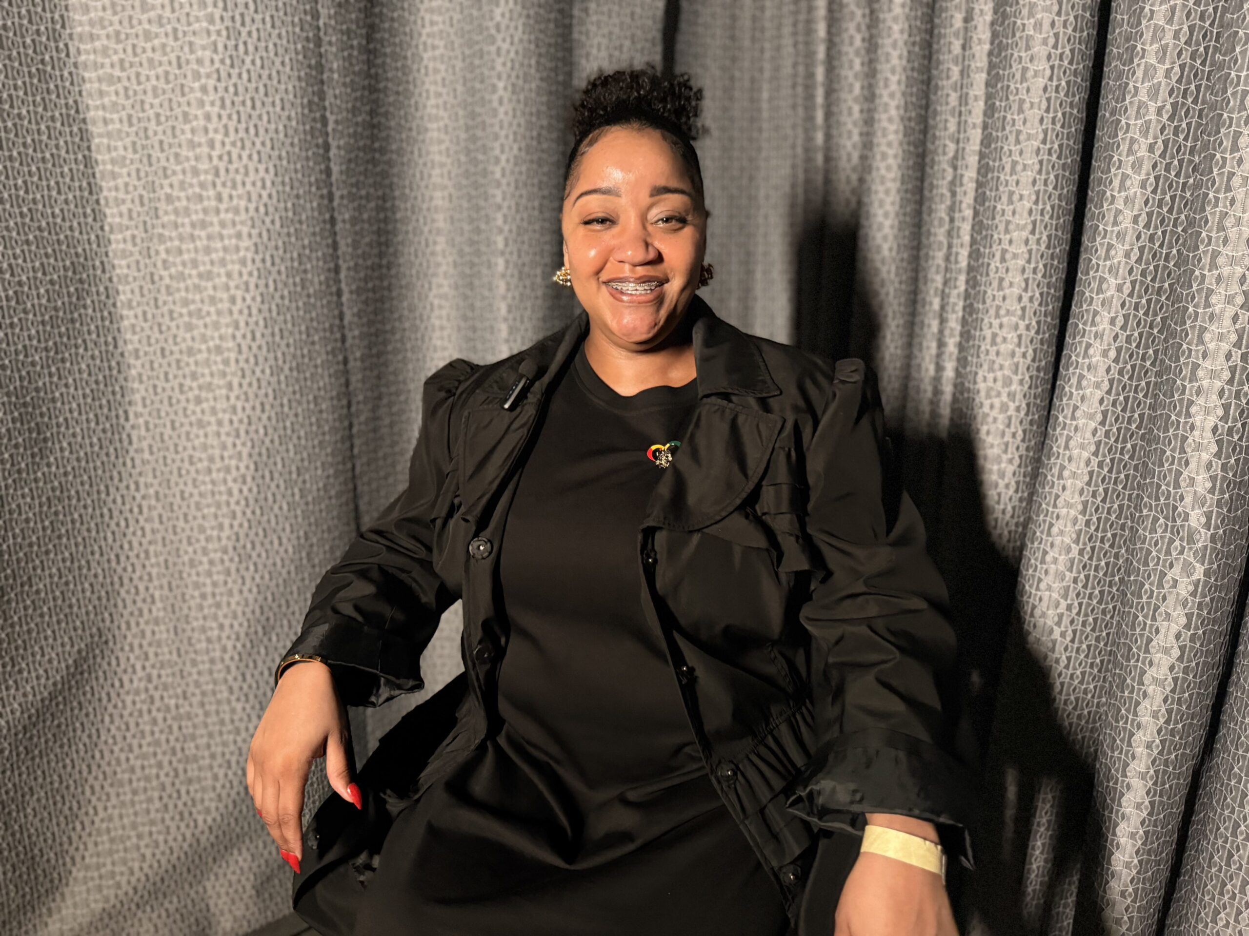 Rachel Gordon seated during an interview, sharing her experience rebuilding stability after homelessness with support from St. Joseph Center.