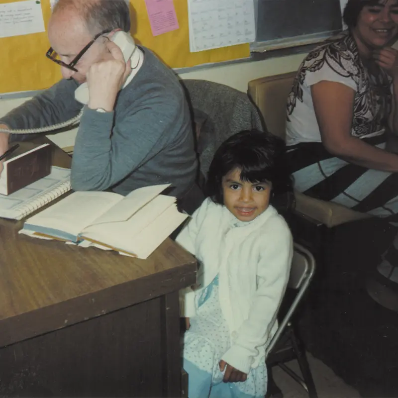 sjc-1980s-child-sitting-with-volunteers