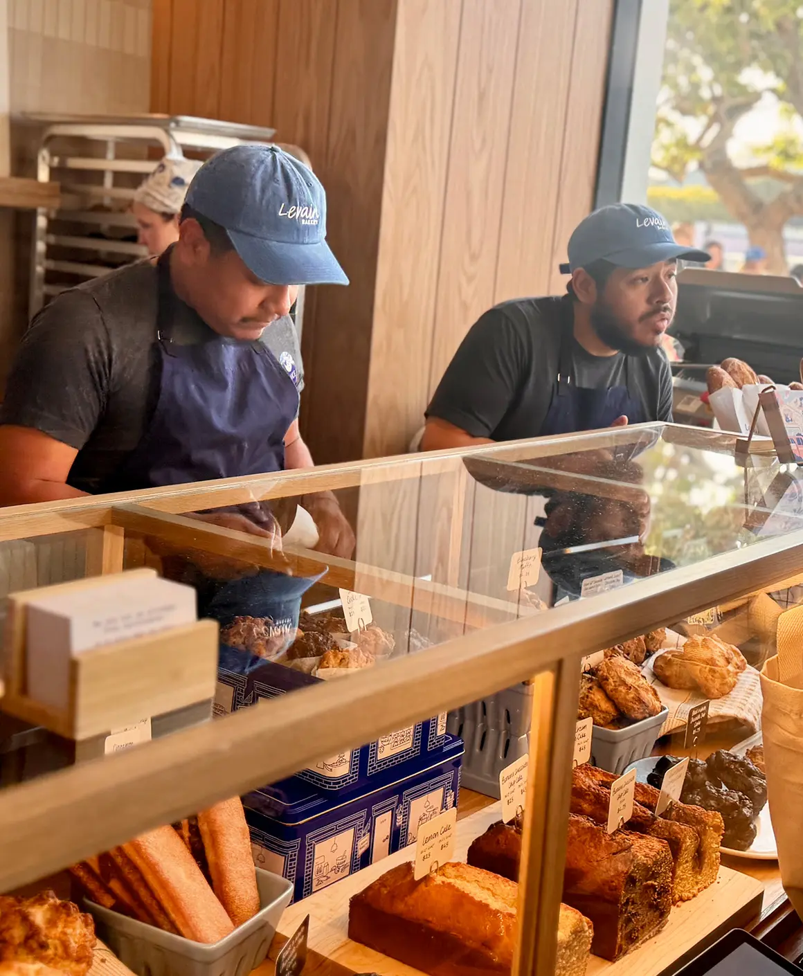 Two Bread and Rose employees working.