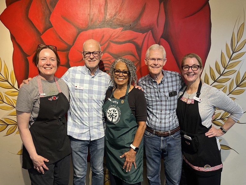 Yvette Coleman standing with fellow volunteers at Bread and Roses Café at St. Joseph Center