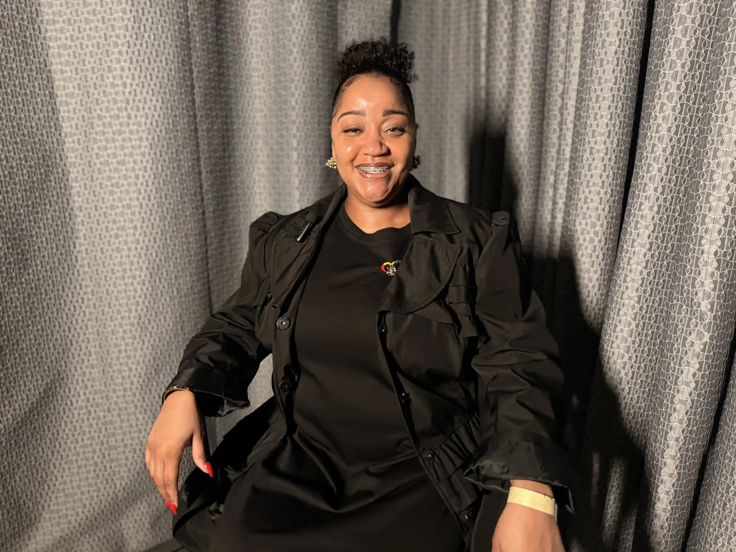 Rachel Gordon seated during an interview, sharing her experience rebuilding stability after homelessness with support from St. Joseph Center.